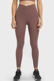 Brown performance leggings with sculpted waistband and pockets
