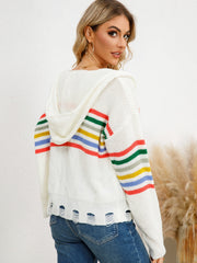 White distressed knit hoodie with rainbow stripes on sleeves and hem.