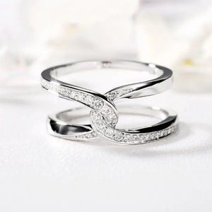 Silver intertwined pavé band ring with cubic zirconia accents