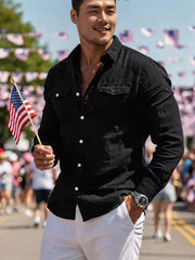 Black casual button-up shirt with two chest pockets and white buttons.