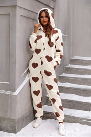 Heart-print sherpa onesie with hood in cream with brown hearts.