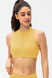 Banana Yellow high-neck zip-front active crop top with sleeveless cut.