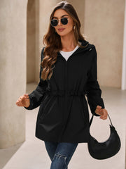 Black hooded windbreaker jacket with ruffled drawstring waist and zip front.