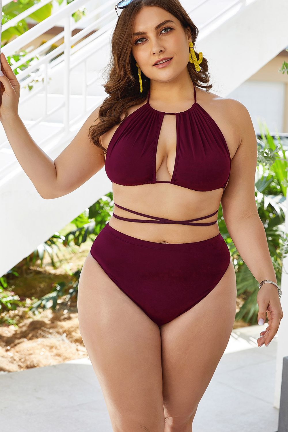 Burgundy halter bikini with keyhole cutout top and high-waist bottoms.