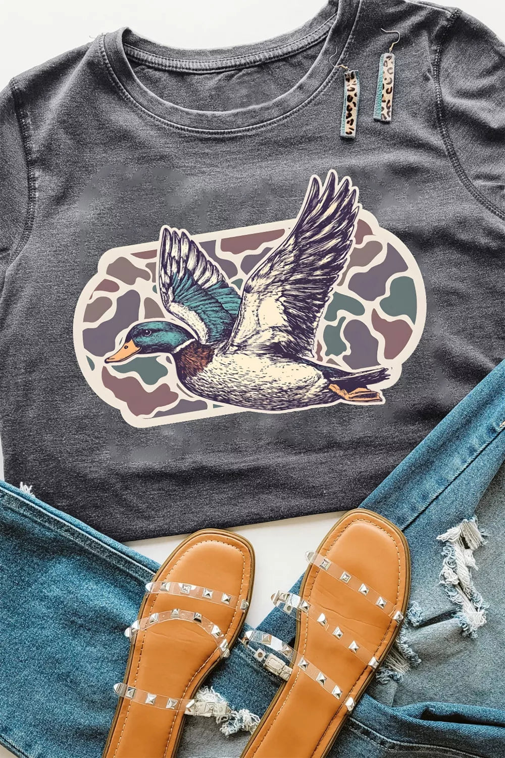 Gray polyester t-shirt with flying mallard graphic and camouflage background.