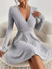 Light gray ribbed wrap mini dress with long sleeves and a V-neck.