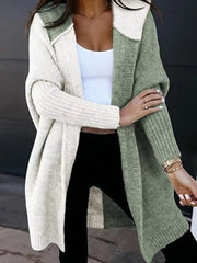 Two-tone hooded knit cardigan in matcha green and cream acrylic with ribbed sleeves.