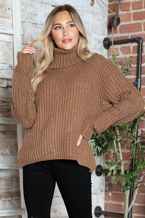Brown chunky ribbed turtleneck sweater with relaxed fit and long sleeves.
