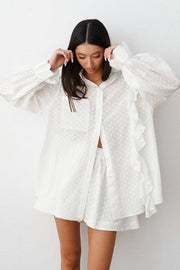 White textured ruffle trim shirt set with collared neckline and puff sleeves.