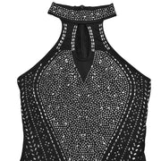 Black halter neck romper with rhinestone embellishments and keyhole cutout.