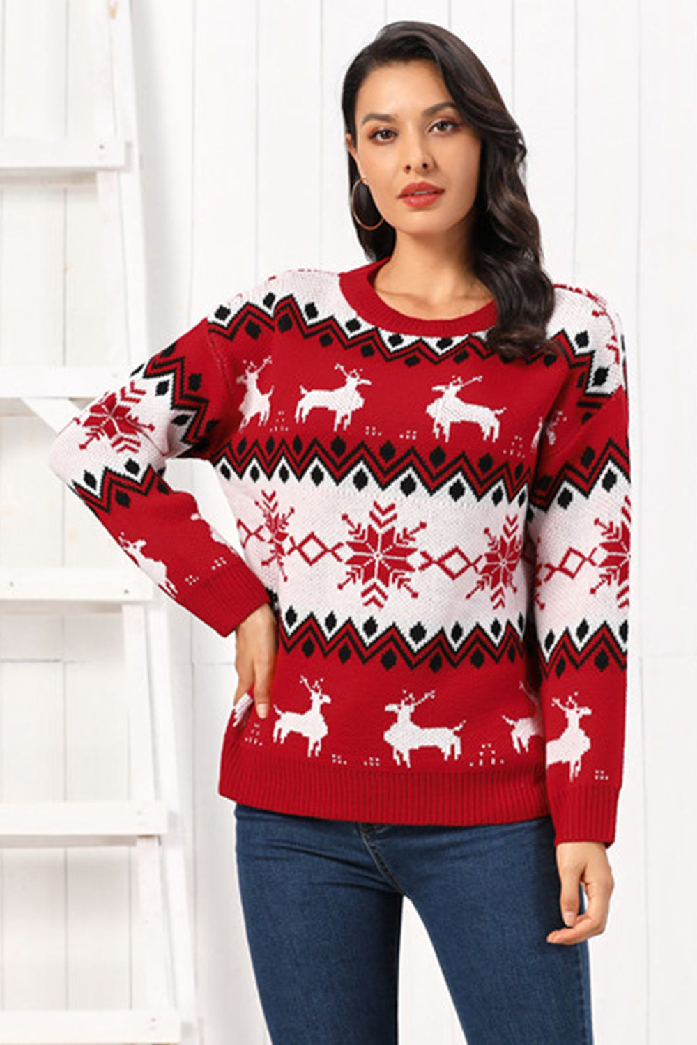 Red acrylic sweater with reindeer and snowflake Fair Isle pattern, crew neck, long sleeves.