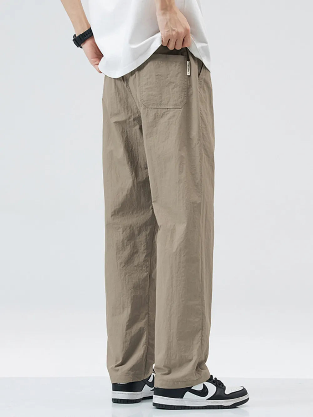 Relaxed fit wide-leg sweatpants in khaki with a back pocket detail.