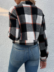 Checked plaid shacket with patch pockets in black, white, and rust.