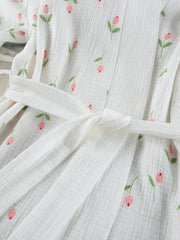 White cotton robe with pink floral print and tie waist