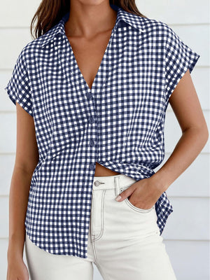 Navy gingham print tied button-down shirt with short sleeves and a collared neckline.