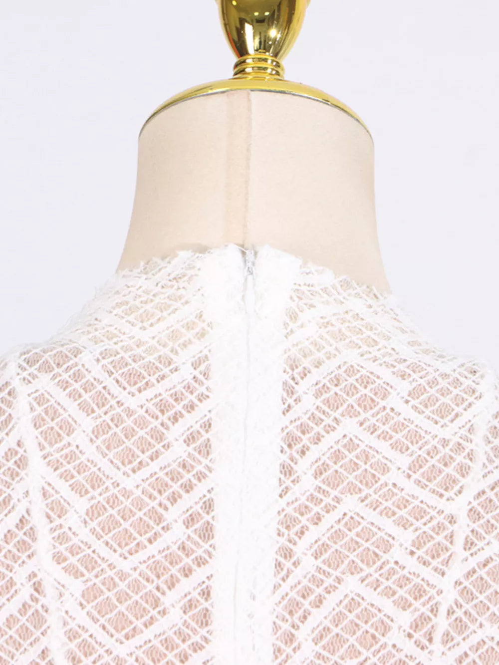 White lace maxi dress with mock neck and back zipper detail.
