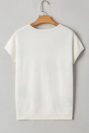 White knit tunic t-shirt with short sleeves and a ribbed hem.