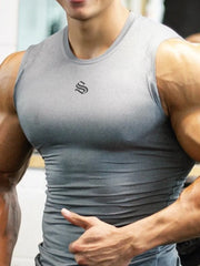 Performance Fit Muscle Tank in gray with a black logo, showing a close-up of the chest and arms.
