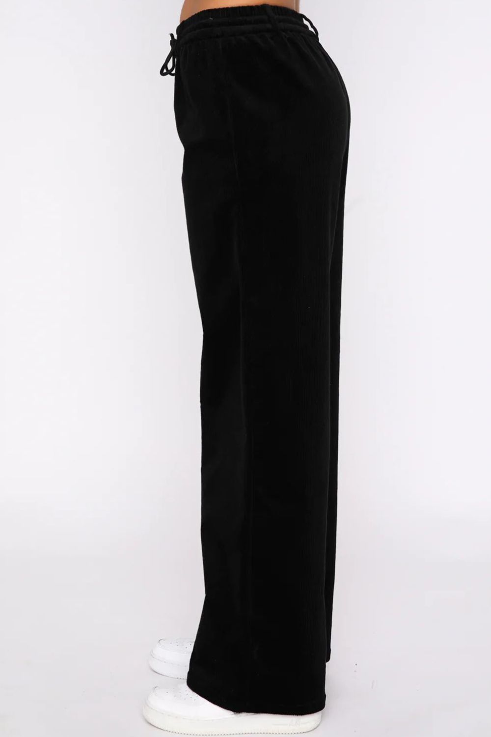 Black velvet lounge pants with drawstring waist and wide legs.