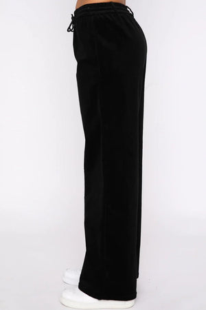 Black velvet lounge pants with drawstring waist and wide legs.
