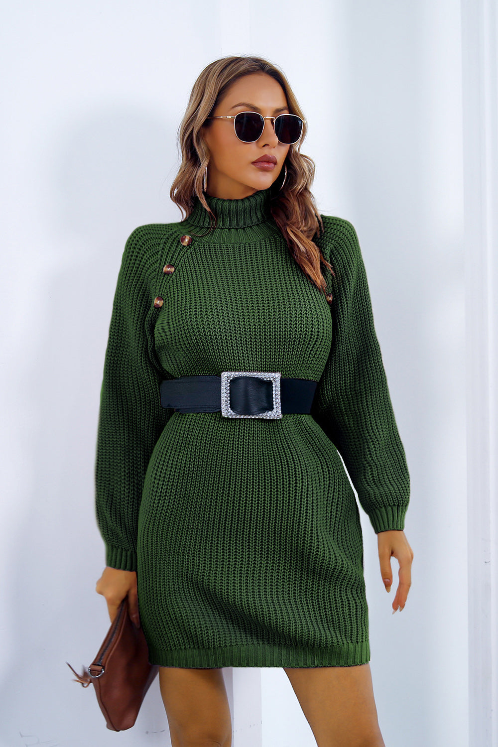 Green knit turtleneck mini dress with button detail and black belt