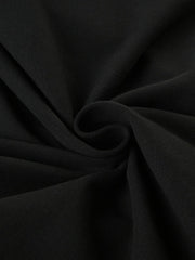 Black long-sleeve active romper with boat neck, showing fabric texture.