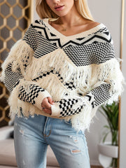 Beige acrylic sweater with geometric pattern and fringe details.