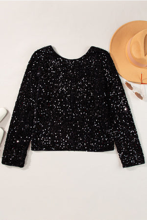 Black sequin long sleeve blouse with a backless design.