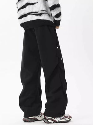 Black cargo sweatpants with snap details on the side pockets.