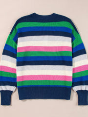 Chunky knit crewneck sweater with bold horizontal stripes in green, blue, white, and pink.