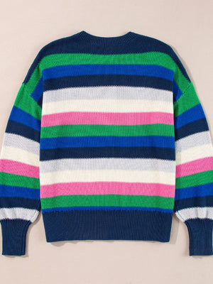 Chunky knit crewneck sweater with bold horizontal stripes in green, blue, white, and pink.