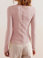Ribbed button-up top in Blush Pink with long sleeves and a seam detail down the back.