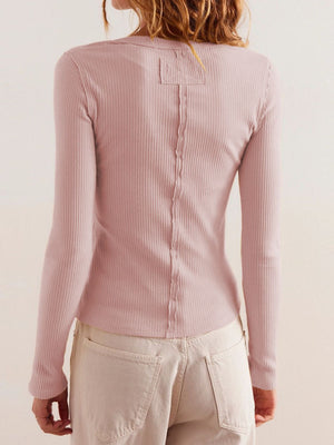 Ribbed button-up top in Blush Pink with long sleeves and a seam detail down the back.
