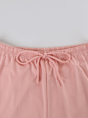 Pink lounge set shorts with elastic waist and decorative bow detail