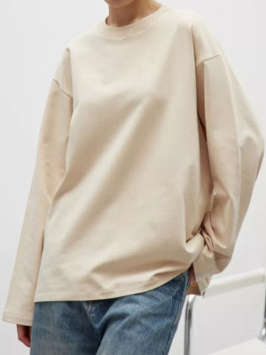 Oversized crewneck sweatshirt in tan with voluminous sleeves and crew neckline.