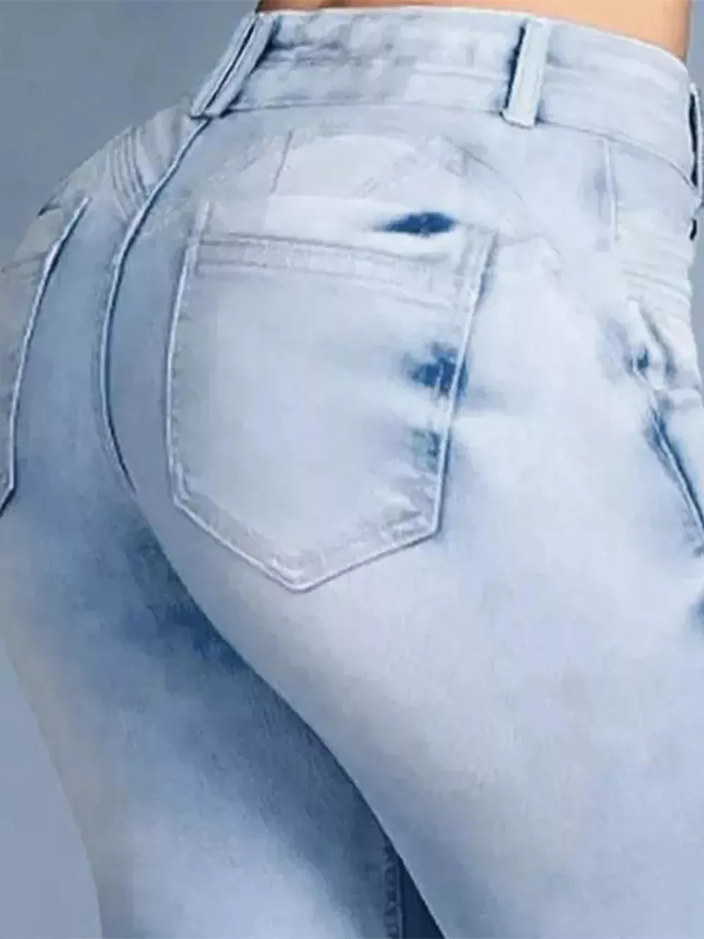 Light blue cotton spandex jeans with high waist and flared leg, showing back pocket detail.
