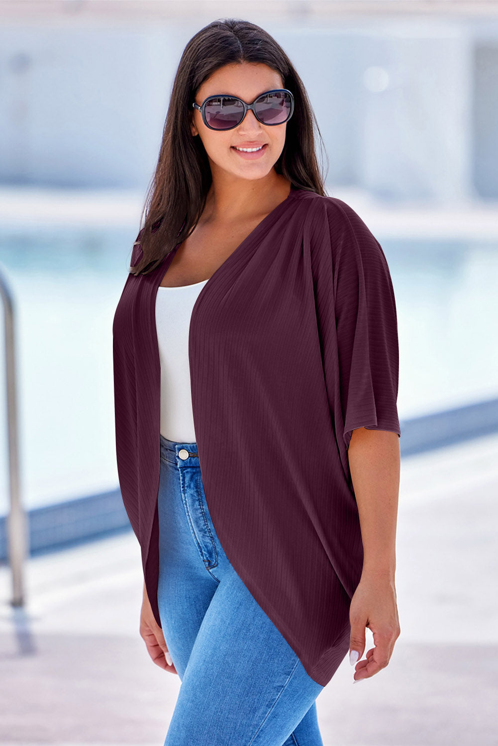 Drape-front ribbed batwing cardigan in deep purple with short sleeves.