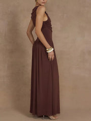 Brown ruched maxi dress with asymmetric neckline and sleeveless cut.