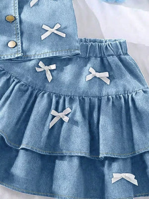 Light blue denim halter set with white bow accents and tiered skirt.