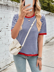Striped knit tee with red trim and short sleeves, styled with a crossbody bag.