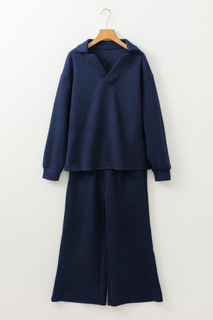 Navy textured polo top and wide-leg culottes set with a geometric pattern.
