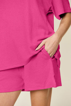 Waffle knit boxy tee and shorts set in hot pink with pockets.