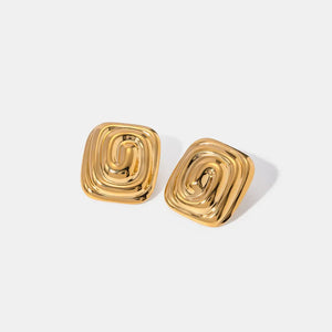 Gold square earrings with a sculpted swirl design.
