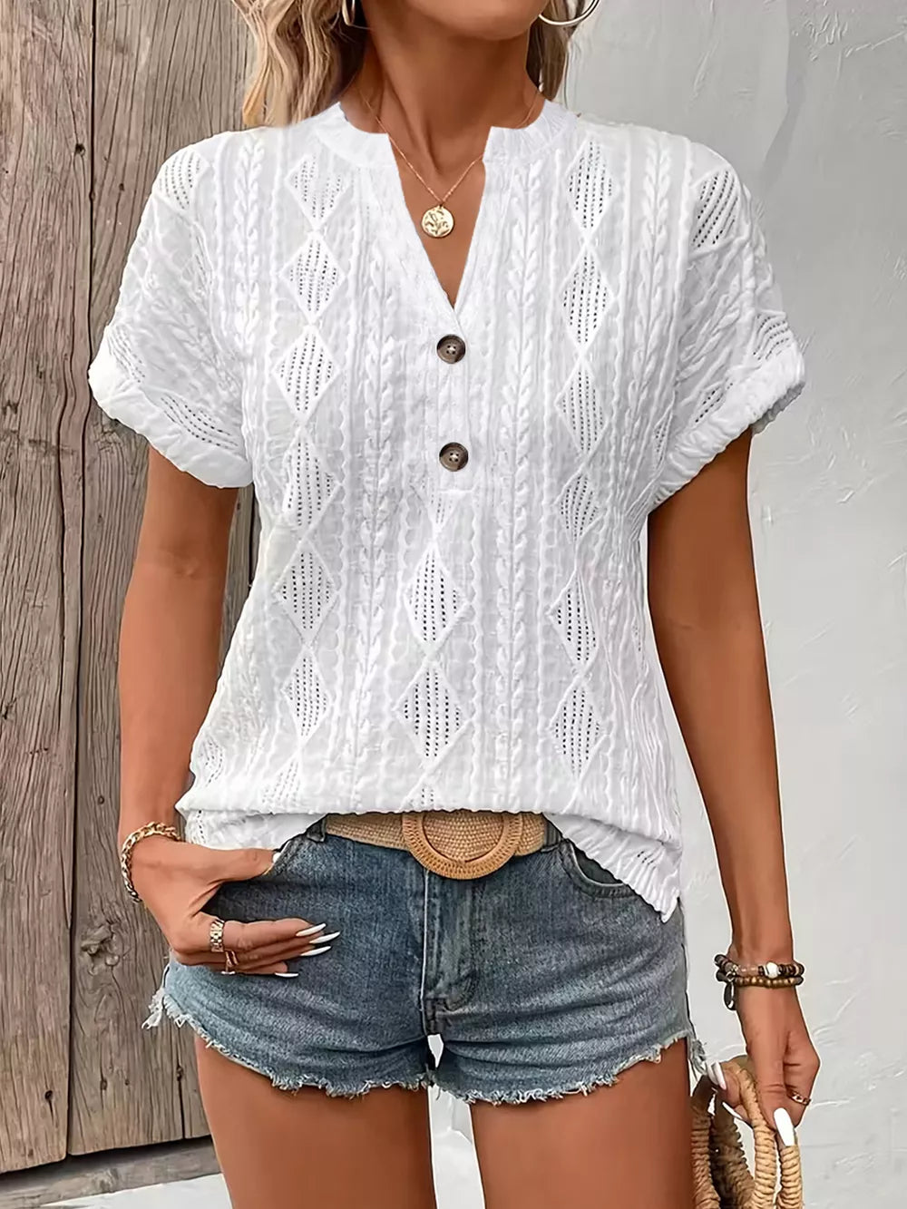 White diamond pattern short-sleeve t-shirt with button detail and v-neck