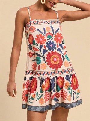 Playful printed mini dress with spaghetti straps, square neckline, and ruffled hem in multicolor.