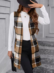 Tartan longline vest in camel, black, and white plaid with a buttoned front.