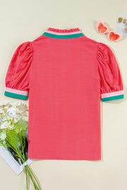 Colorblock puff sleeve blouse in strawberry pink with green and pink collar and cuffs.