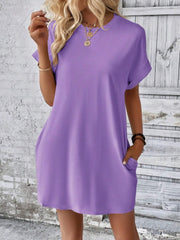Relaxed tee dress in lavender with cuffed sleeves and pockets.