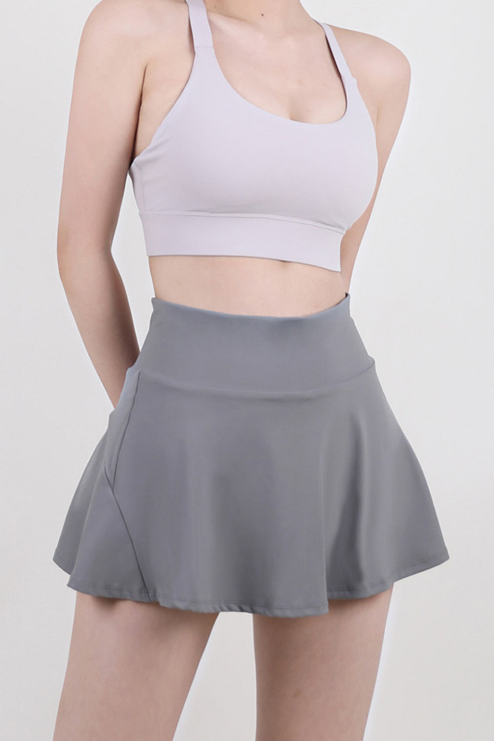 Sculpted flared skort in dark gray, breathable activewear with a comfortable fit.