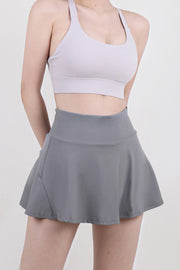 Sculpted flared skort in dark gray, breathable activewear with a comfortable fit.